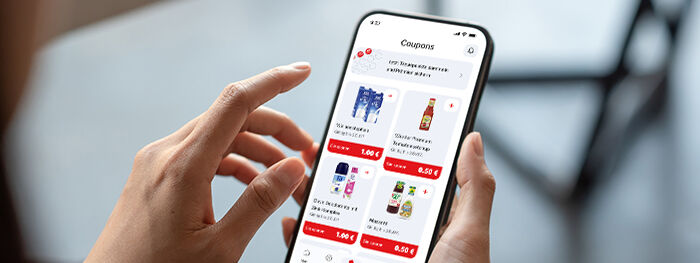Smartphone mit den aktuellen Coupons in der HIT-App